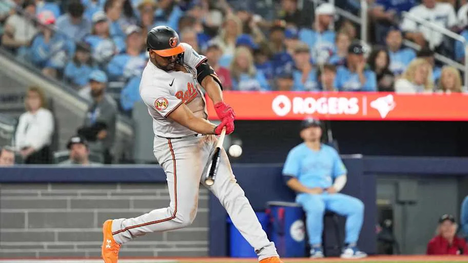 Baltimore Orioles Eloy Jimnez  swinging a baseball bat