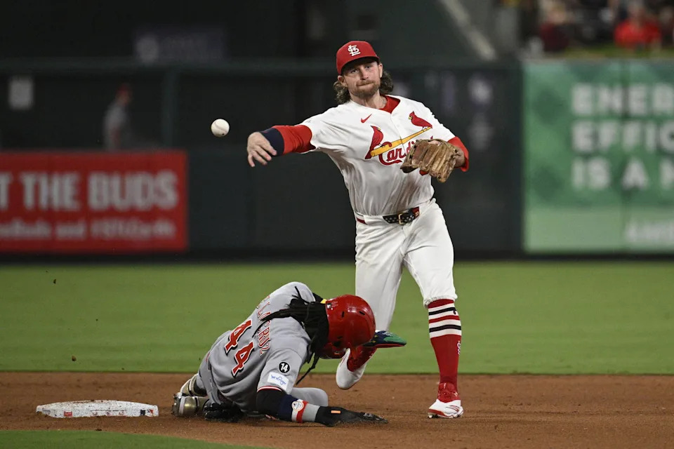 Sep 16, 2025; St. Louis, Missouri, USA; Cincinnati Reds shortstop Elly De La Cruz (44) is out at second base as St. Louis Cardinals second baseman Brendan Donovan (33) turns a double play in the fifth inning at Busch Stadium. (Joe Puetz/Imagn Images)