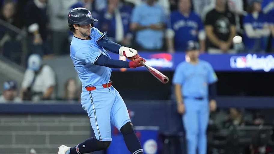 Toronto Blue Jays third baseman Ernie Clement hits a double in the World Series.