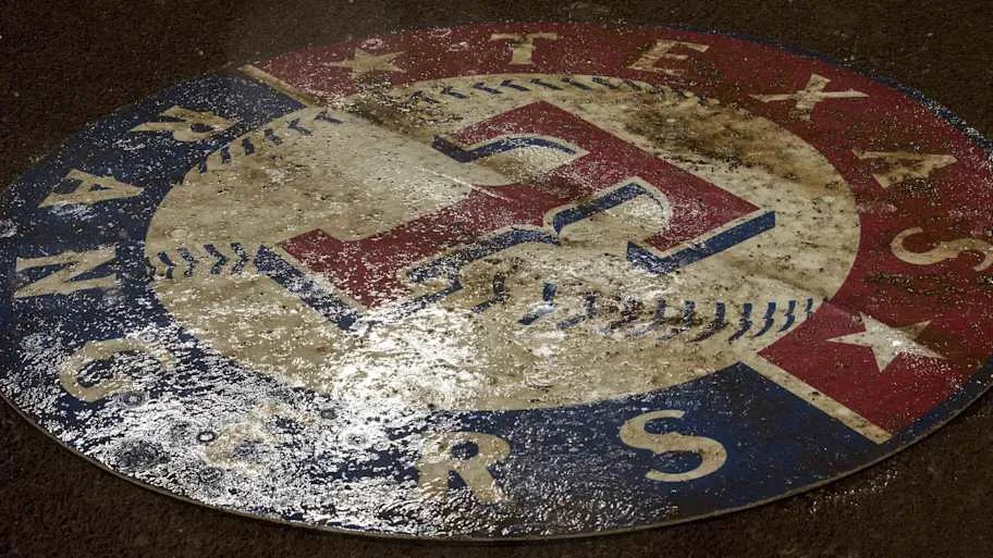 A Texas Rangers logo laying on the groun