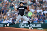 Miami Marlins starting pitcher Cal Quantrill throws to a Seattle Mariners batter during the...