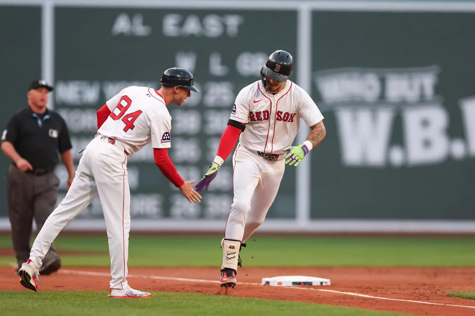 Jun 11, 2025; Boston, Massachusetts, USA; Boston Red Sox left fielder Jarren Duran (16) hits a solo home run during the first inning against the Tampa Bay Rays at Fenway Park. (Paul Rutherford/Imagn Images)