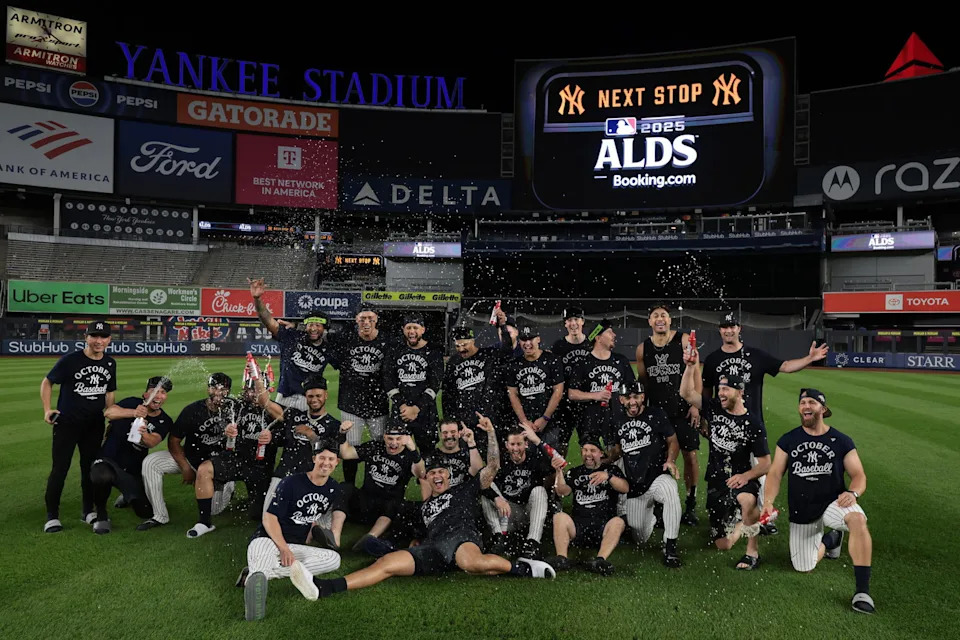 Oct 2, 2025; Bronx, New York, USA; New York Yankees players pose for a team photo after defeating the Boston Red Sox in game three of the Wildcard round for the 2025 MLB playoffs at Yankee Stadium. (Vincent Carchietta/Imagn Images)