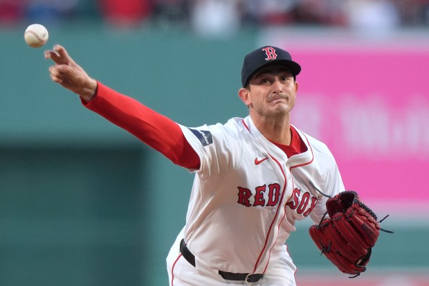 Boston Red Sox starter Garrett Whitlock delivers a pitch to a Cleveland batter during first-inning action at Fenway Park last April. (AP Photo/Steven Senne)