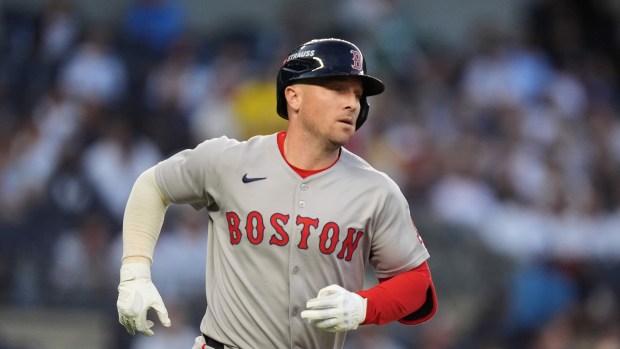 Boston Red Sox Alex Bregman runs to first base on a single against the New York Yankees during Game 1 of an American League wild-card baseball playoff series, Tuesday, Sept. 30, 2025, in New York. (AP Photo/Frank Franklin II)