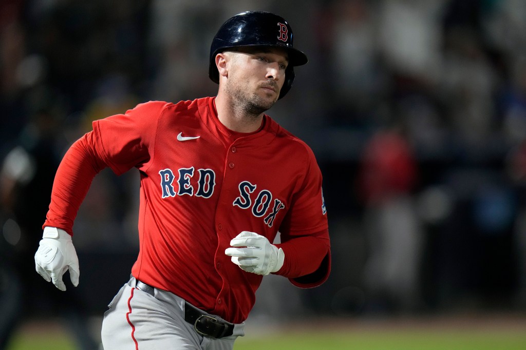 A baseball player wearing a red "Red Sox" jersey, a batting helmet, and white gloves, looking towards the right while running.