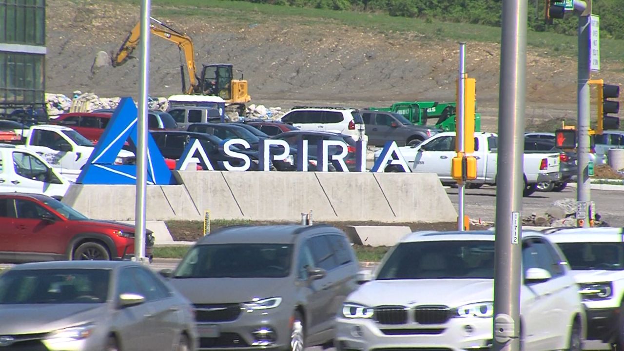 Cars drive by the Aspiria Campus located in Overland Park, Kansas. (Spectrum News)