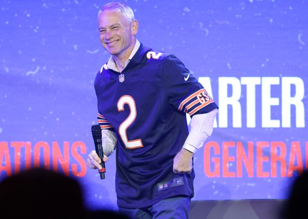 Cubs President of Baseball Operations Jed Hoyer shows off a Bears jersey during the Cubs Convention at the Sheraton Grand Chicago Riverwalk on Jan. 17, 2025. (John J. Kim/Chicago Tribune)
