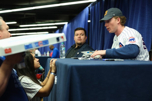 Cubs outfielder Pete Crow-Armstrong talks with Bella Kearns, 14, while signing autographs during the Cubs Convention at the Sheraton Grand Chicago Riverwalk on Jan. 17, 2025. (John J. Kim/Chicago Tribune)