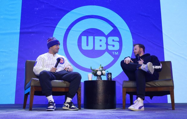 New Cubs player Alex Bregman, left, and infielder Ian Happ have a discussion during the Cubs Convention at the Sheraton Grand Chicago Riverwalk on Jan. 17, 2025. (John J. Kim/Chicago Tribune)