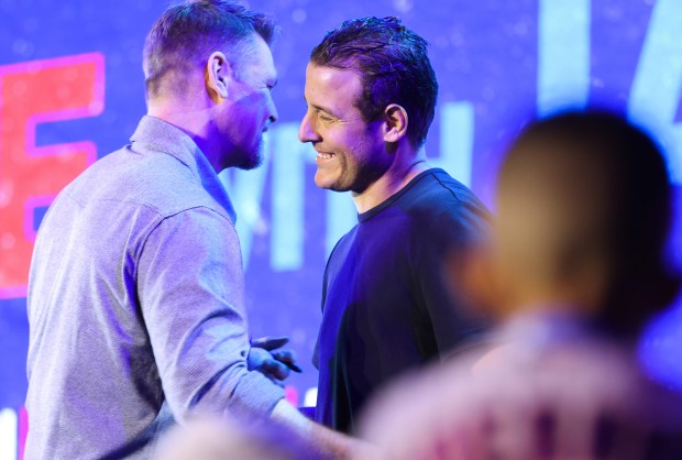 Former Cubs pitcher Kerry Wood, left, and former infielder Anthony Rizzo greet each other on stage during the Cubs Convention at the Sheraton Grand Chicago Riverwalk on Jan. 17, 2025. (John J. Kim/Chicago Tribune)