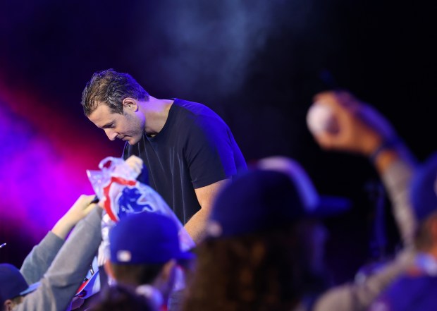 Former Cubs infielder Anthony Rizzo signs autographs before having a discussion with infielder Ian Happ during the Cubs Convention at the Sheraton Grand Chicago Riverwalk on Jan. 17, 2025. (John J. Kim/Chicago Tribune)
