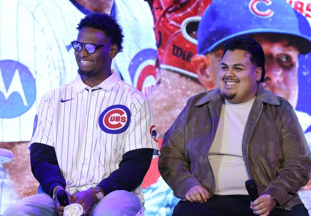 Cubs pitcher Edward Cabrera, left, participates in a discussion with help from an interpreter during the Cubs Convention at the Sheraton Grand Chicago Riverwalk on Jan. 17, 2025. (John J. Kim/Chicago Tribune)