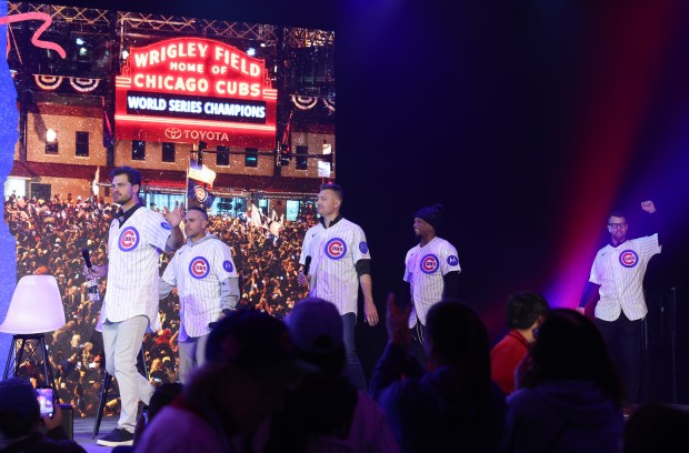 Former Cubs players from the 2016 World Series Champions team, including Justin Grimm, from left, Miguel Montero, Mike Montgomery, Pedro Strop and Ben Zobrist walk on stage for a discussion during the Cubs Convention at the Sheraton Grand Chicago Riverwalk on Jan. 17, 2025. (John J. Kim/Chicago Tribune)