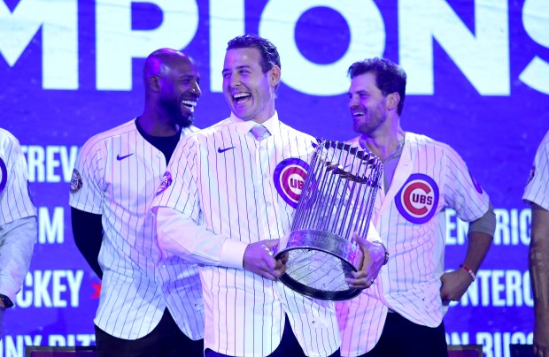 Former Chicago Cubs first baseman Anthony Rizzo has a laugh while holding the World Series trophy as the 2016 championship team is honored during day 1 of the Cubs Convention at the Sheraton Grand Chicago on Friday, Jan. 16, 2026. (Chris Sweda/Chicago Tribune)