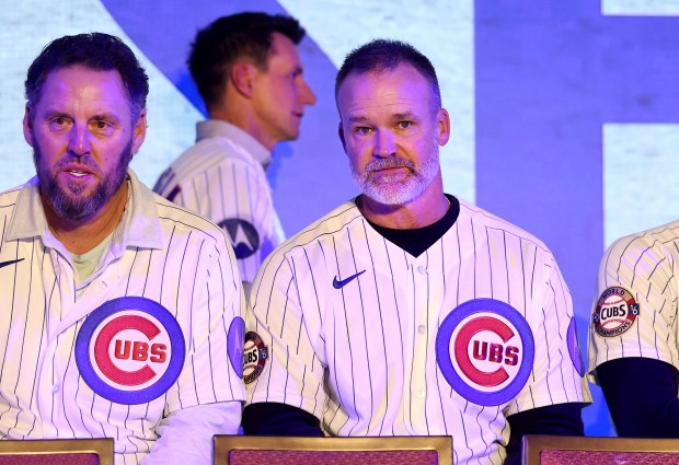 Former Chicago Cubs manager and catcher David Ross sits with members of the 2016 championship team as current manager Craig Counsell walks behind Ross after Counsell was introduced during day 1 of the Cubs Convention at the Sheraton Grand Chicago on Friday, Jan. 16, 2026. (Chris Sweda/Chicago Tribune)