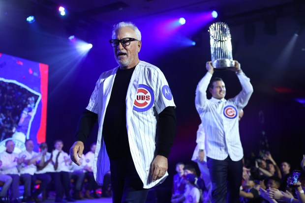 Former Chicago Cubs manager Joe Maddon and former Cubs first baseman Anthony Rizzo walk on stage as the 2016 World Champions are honored during day 1 of the Cubs Convention at the Sheraton Grand Chicago on Friday, Jan. 16, 2026. (Chris Sweda/Chicago Tribune)