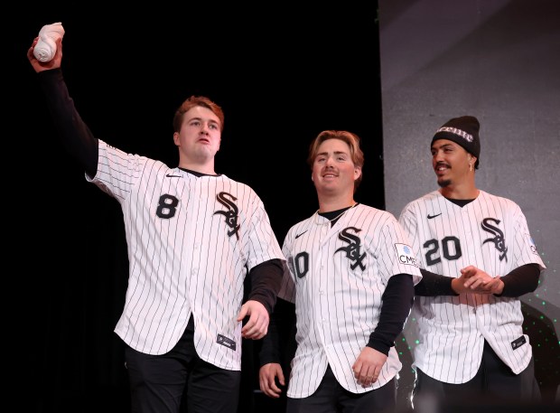 Chicago White Sox catcher Kyle Teel (8), second baseman Chase Meidroth (10), and third baseman Miguel Vargas (20) stand on stage during SoxFest at the Ramova Theatre in Chicago's Bridgeport neighborhood on Friday, Jan. 30, 2026. (Chris Sweda/Chicago Tribune)