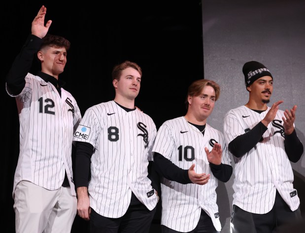 Chicago White Sox shortstop Colson Montgomery (12), catcher Kyle Teel (8), second baseman Chase Meidroth (10), and third baseman Miguel Vargas (20) stand on stage during SoxFest at the Ramova Theatre in Chicago's Bridgeport neighborhood on Friday, Jan. 30, 2026. (Chris Sweda/Chicago Tribune)