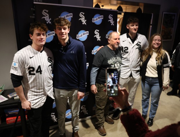 Chicago White Sox prospect Sam Antonacci (24) and shortstop Colson Montgomery (12) pose for photos with fans during SoxFest at the Ramova Theatre in Chicago's Bridgeport neighborhood on Friday, Jan. 30, 2026. (Chris Sweda/Chicago Tribune)
