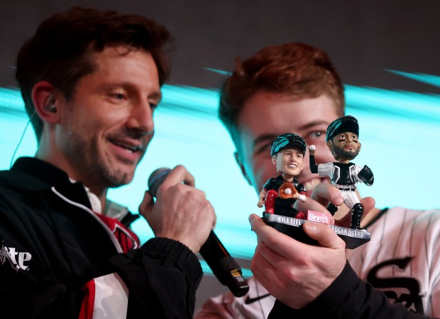 Kyle Teel looks at a new bobblehead of himself and fellow White Sox catcher Edgar Quero together during SoxFest Live at the Ramova Theatre on Friday, Jan. 30, 2026, in Bridgeport. (Chris Sweda/Chicago Tribune)