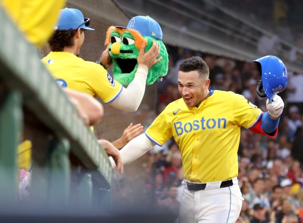 Red Sox third baseman Alex Bregman, right, celebrates after his home run against the Yankees on Sept. 13, 2025, in Boston. (Mark Stockwell/AP)