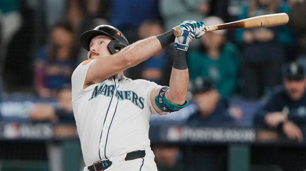 Seattle Mariners catcher Cal Raleigh (29) hits a solo home run against the Toronto Blue Jays in the eighth inning during game five of the ALCS round for the 2025 MLB playoffs at T-Mobile Park.