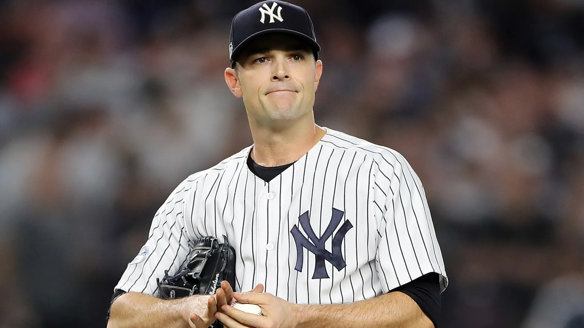 David Robertson #30 with the Yankees reacts against the Red Sox. Elsa/Getty Images