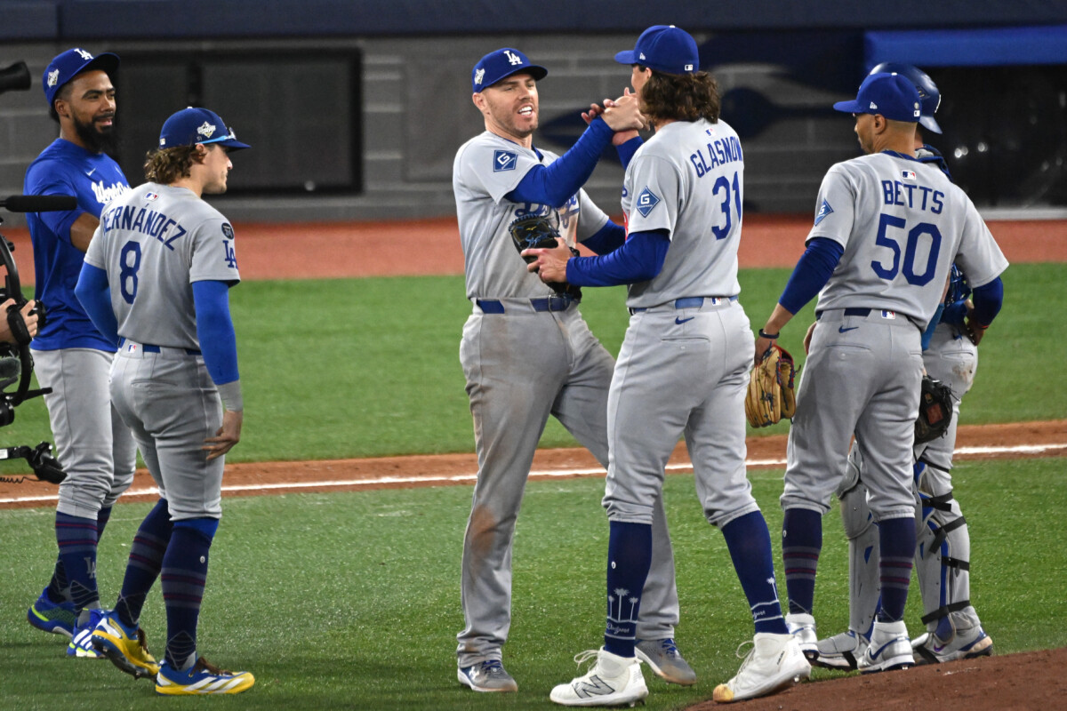 The Los Angeles Dodgers celebrate on the mound after winning Game 6 of the 2025 World Series.