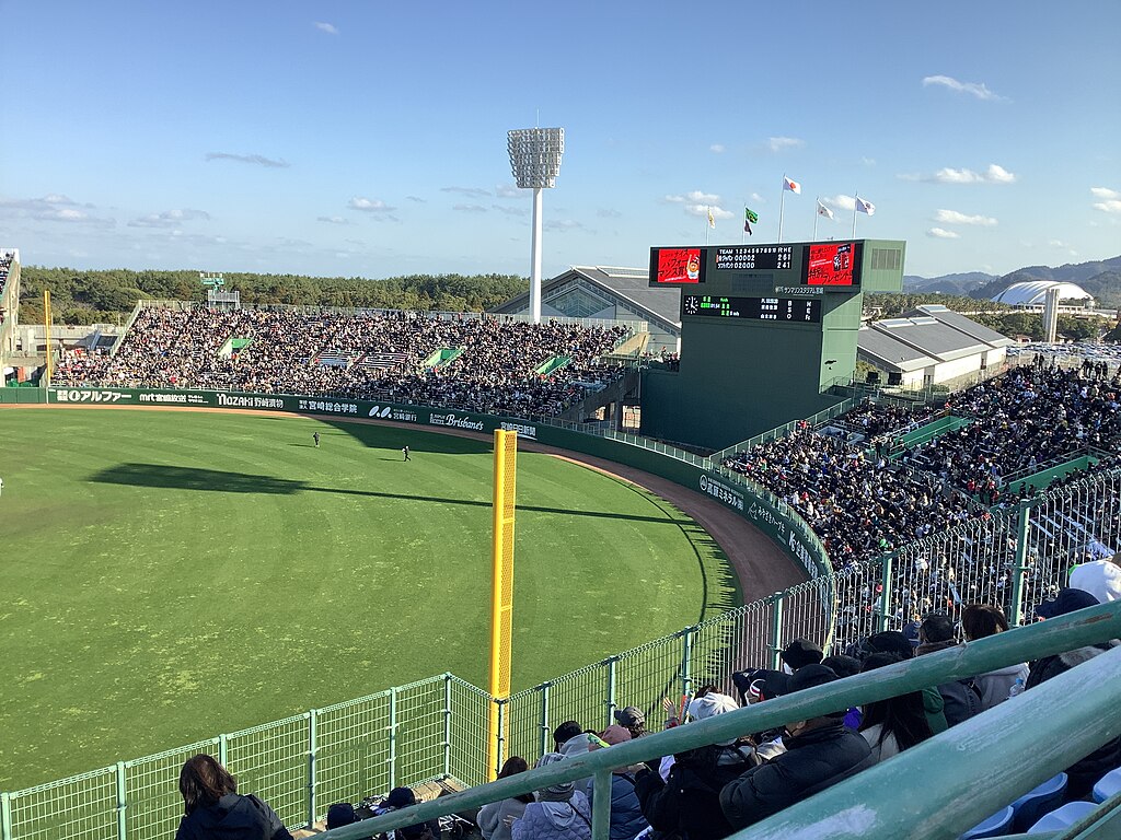 A crowd watches the Fukuoka Softbank Hawks in action.
