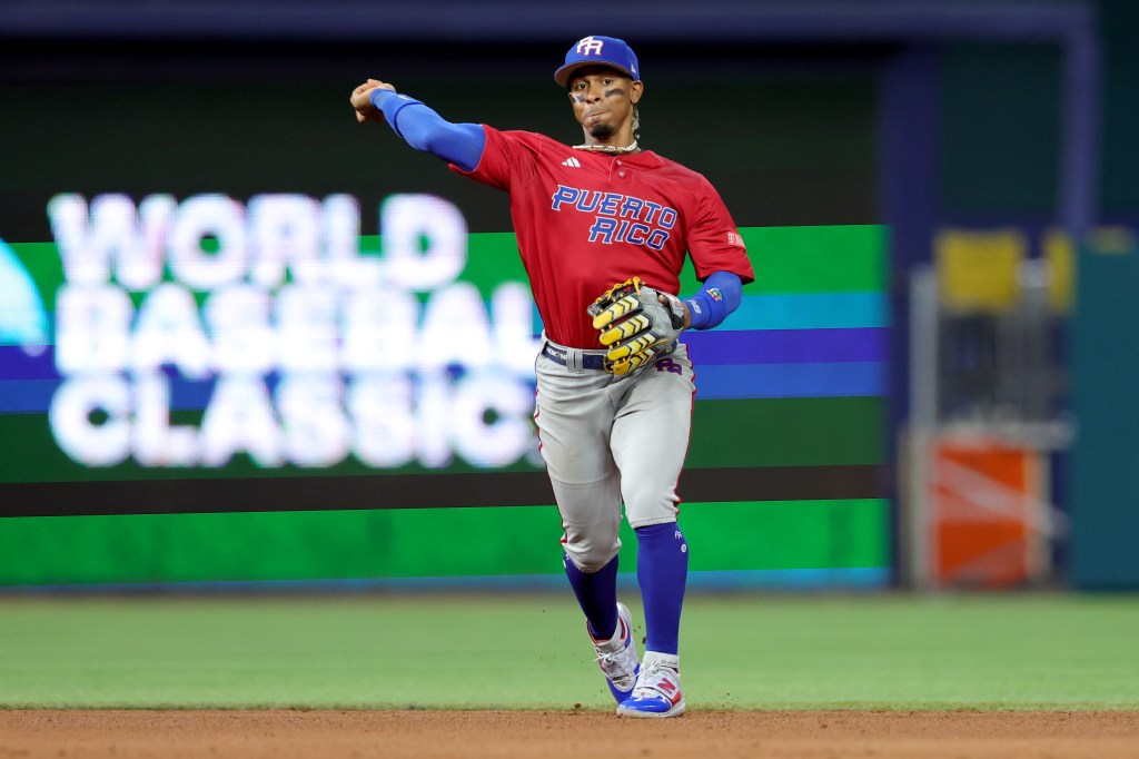 Francisco Lindor #12 of Team Puerto Rico fields a hit against Team Mexico during the eighth inning in the World Baseball Classic Quarterfinals game at loanDepot park on March 17, 2023 in Miami, Florida.