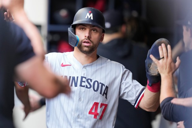 Edouard Julien #47 of the Minnesota Twins celebrates after scoring a run in the first inning against the Milwaukee Brewers at American Family Field on August 23, 2023 in Milwaukee.