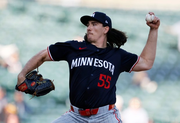 Kody Funderburk prepares to throw a baseball.