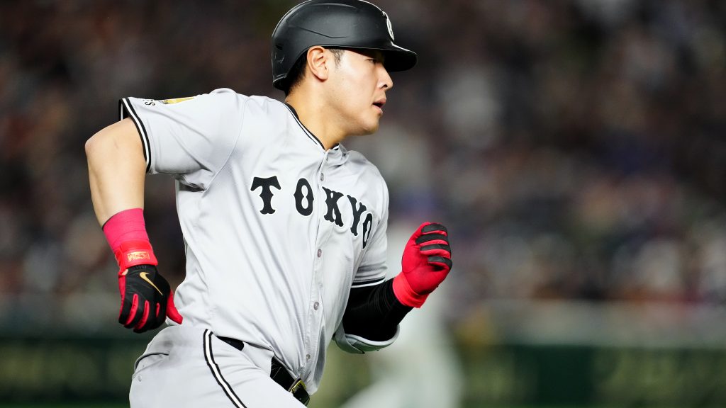 Kazuma Okamoto #25 of the Yomiuri Giants hits a two-run double in the fifth inning during the game between the Chicago Cubs and the Yomiuri Giants at Tokyo Dome on Sunday, March 16, 2025 in Tokyo, Japan. (Photo by Mary DeCicco/MLB Photos via Getty Images)