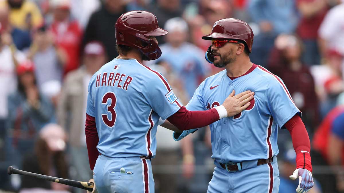 Philadelphia Phillies designated hitter Kyle Schwarber (12) celebrates his home run with first base Bryce Harper (3) during the seventh inning against the Colorado Rockies at Citizens Bank Park.