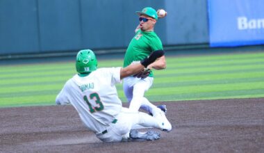 Hawaii baseball great Kolten Wong turned a double play at second base in the UH alumni game on Saturday, tagging second ahead of the slide by Tate Shimao and throwing to first for the second out.
