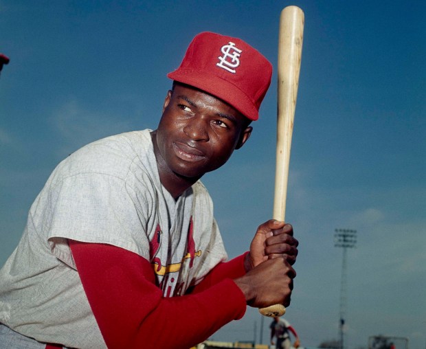 Lou Brock of the St. Louis Cardinals poses in 1965. By the time of his 1979 retirement, the left fielder, leadoff hitter and base stealer had helped his team win three pennants and three World Series titles. (AP Photo)