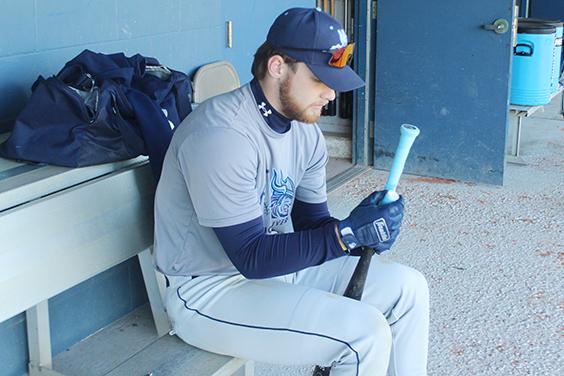 Returning top St. Johns River State College hitter Brody Dalton finishes putting tape on his bat before taking batting practice. (MARK BLUMENTHAL / Palatka Daily News)