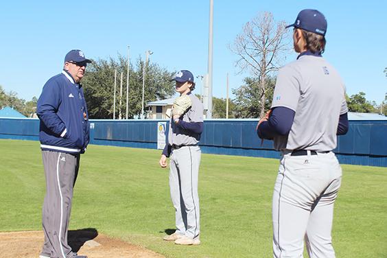 St. Johns River State College head coach Ross Jones talks with pitchers Connor Hill (center) and Aiden Neff during practice last week. (MARK BLUMENTHAL / Palatka Daily News)