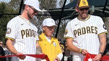 Dan Engel (center) cuts the ribbon, Sunday, with help from Padres pitcher Joe Musgrove (right) and Padres outfielder,                             Jackson Merrill, at the newly named Padres Park, January 25, 2026.
