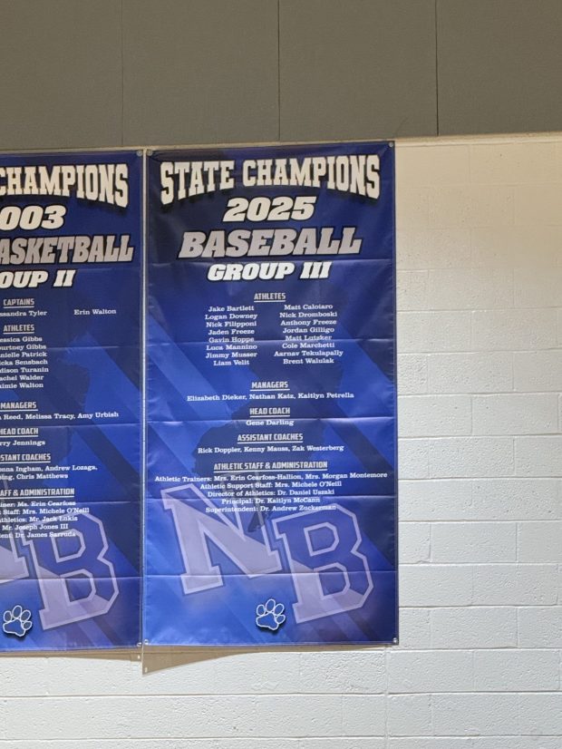 Northern Burlington's 2025 Group III state championship baseball banner was unveiled Monday during the boys basketball team's game against Allentown. (Greg Johnson/ Trentonian Photo)