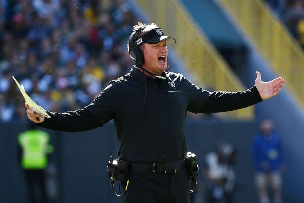 Jon Gruden got a large gift box from UConn and flashed his knowledge of school history, with some blanks to be filled in.