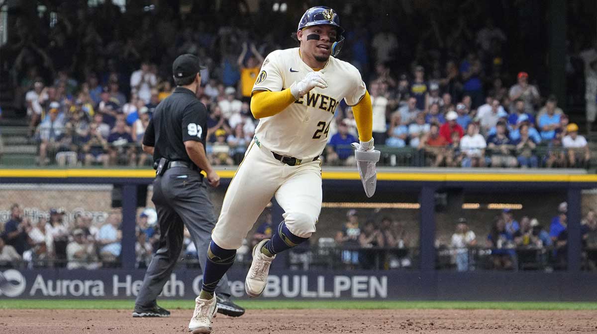 Milwaukee Brewers catcher William Contreras (24) scores from second base agasint the Pittsburgh Pirates in the fourth inning at American Family Field.