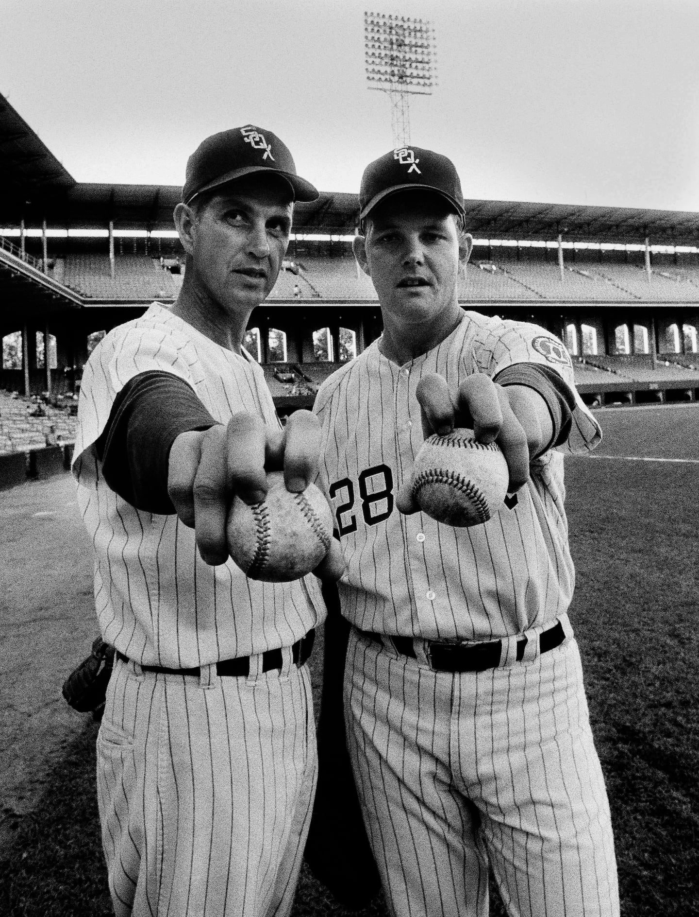 Mr. Wood (right) and his mentor, Hoyt Wilhelm, offered their grips on their favorite pitch, July 20, 1968, in Chicago.