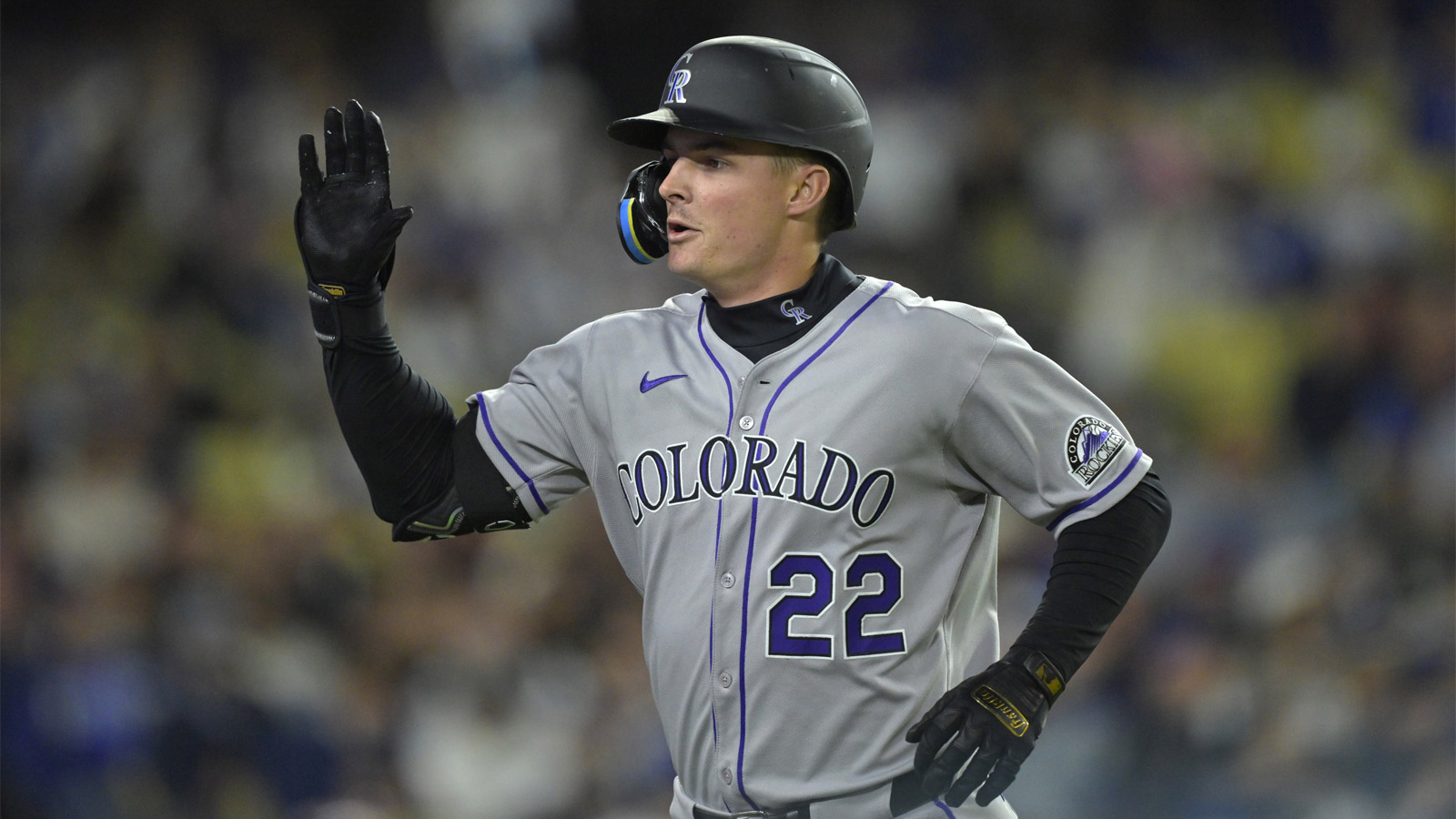 Colorado Rockies outfielder Mickey Moniak (22) celebrates after hitting a solo home run in the third inning against the Los Angeles Dodgers at Dodger Stadium.