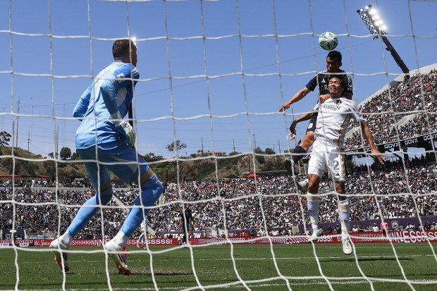 San Diego FC midfielder Hirving Lozano (11) heads the ball in for a goal against Los Angeles Galaxy defender Miki Yamane (2) during their match at Snapdragon Stadium on Saturday, May 24, 2025 in San Diego, CA. (Meg McLaughlin / The San Diego Union-Tribune)