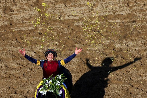 Irad Ortiz Jr. tosses flower pedals after winning the Juvenile Turf Sprint during day one of the 2025 Breeders' Cup World Championships at Del Mar Race Track on Friday, Oct. 31, 2025 in Del Mar, California. (Meg McLaughlin / The San Diego Union-Tribune)