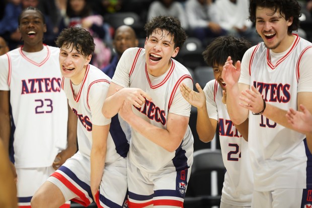 Montgomery's JJ Sanchez (15) and Alek Sanchez (3) celebrate after beating Carlsbad during the CIF Open Division Boys Basketball Championship at Frontwave Arena on Friday, Feb. 28, 2025 in Oceanside, CA. (Meg McLaughlin / The San Diego Union-Tribune)