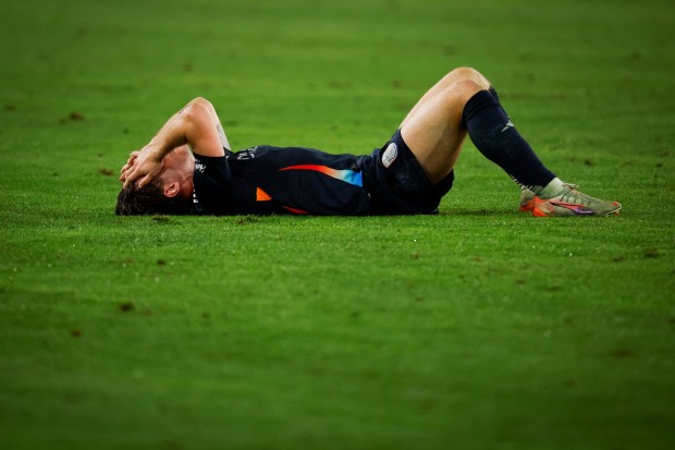 San Diego FC midfielder Anders Dreyer #10 lays on the ground after losing to the Vancouver Whitecaps during the MLS Cup Western Conference Final at Snapdragon Stadium on Saturday, Nov. 29, 2025 in San Diego, California. (Meg McLaughlin / The San Diego Union-Tribune)