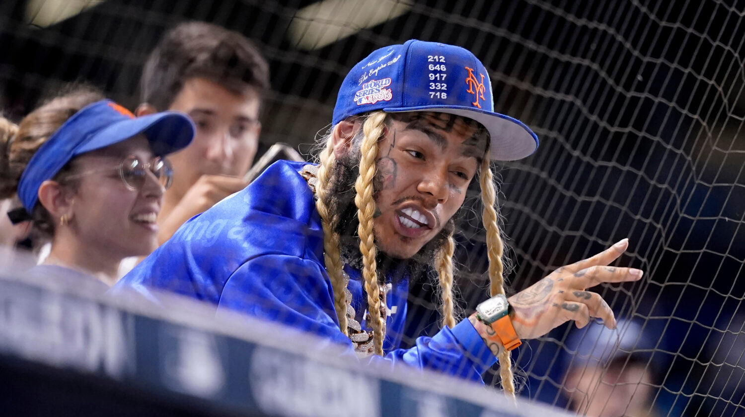 FILE - Rapper Tekashi 6ix9ine watches a baseball game between the Miami Marlins and New York Mets, ...